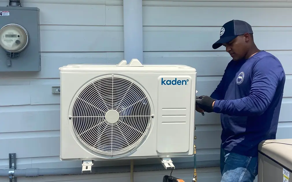 ASR technician charging a Kaden ductless mini-split with manifold gauges