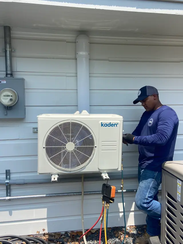 ASR technician charging a Kaden ductless mini-split with manifold gauges